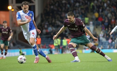 300925 - Blackburn Rovers v Swansea City - Sky Bet Championship - Zan Vipotnik of Swansea and Yuri Ribeiro of Blackburn