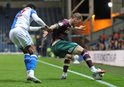 300925 - Blackburn Rovers v Swansea City - Sky Bet Championship -Josh Tymon of Swansea is pulled back by Ryan Alebiosu of Blackburn