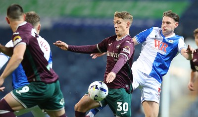 300925 - Blackburn Rovers v Swansea City - Sky Bet Championship - Ethan Galbraith of Swansea and Taylor Gardner-Hickman of Blackburn
