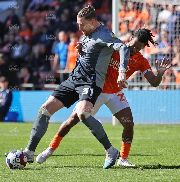 070423 - Blackpool v Cardiff City - Sky Bet Championship - Connor Wickham of Cardiff and Dominic Thompson of Blackpool