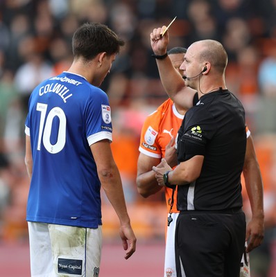 081125 - Blackpool v Cardiff City - Sky Bet League 1 - Rubin Colwill of Cardiff gets shown a yellow card by referee Robert Madley