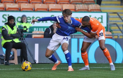 081125 - Blackpool v Cardiff City - Sky Bet League 1 - Cian Ashford of Cardiff is caught by Michael Ihiekwe of Blackpool