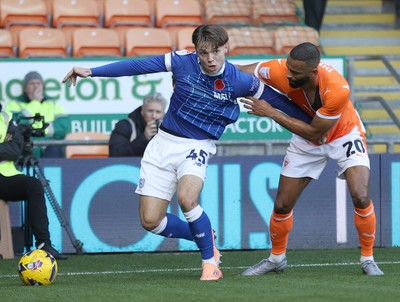 081125 - Blackpool v Cardiff City - Sky Bet League 1 - Cian Ashford of Cardiff is caught by Michael Ihiekwe of Blackpool