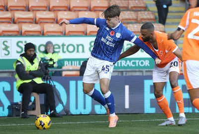 081125 - Blackpool v Cardiff City - Sky Bet League 1 - Cian Ashford of Cardiff is caught by Michael Ihiekwe of Blackpool