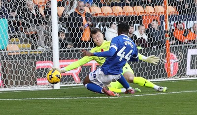 081125 - Blackpool v Cardiff City - Sky Bet League 1 - Goalkeeper Bailey Peacock-Farrell of Blackpool saves on the line from Ronan Kpakio of Cardiff