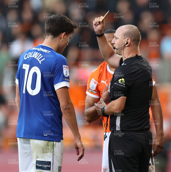 081125 - Blackpool v Cardiff City - Sky Bet League 1 - Rubin Colwill of Cardiff gets shown a yellow card by referee Robert Madley
