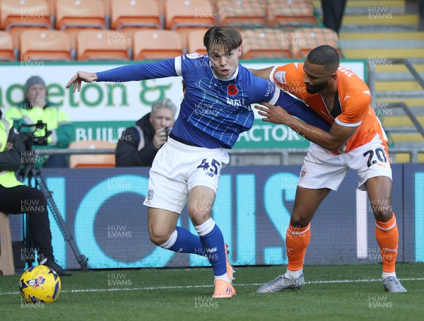 081125 - Blackpool v Cardiff City - Sky Bet League 1 - Cian Ashford of Cardiff is caught by Michael Ihiekwe of Blackpool