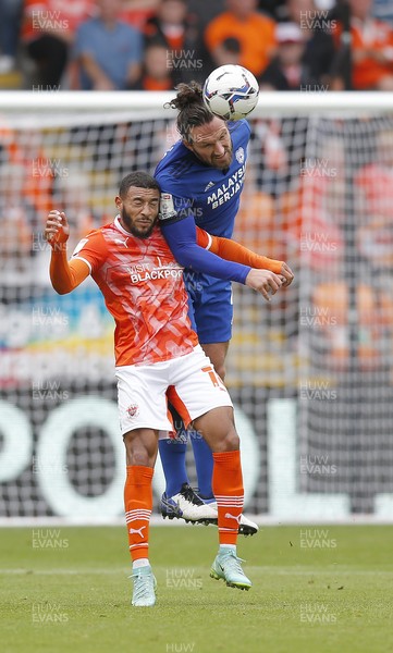 140821 - Blackpool v Cardiff City - Sky Bet Championship - Sean Morrison of Cardiff heads away from Keshi Anderson of Blackpool