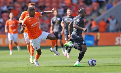 130822 - Blackpool v Swansea City - Sky Bet Championship - Michael Obafemi of Swansea is caught by Marvin Ekpiteta of Blackpool