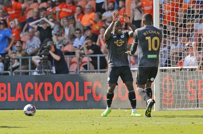 130822 - Blackpool v Swansea City - Sky Bet Championship - Olivier Ntcham of Swansea celebrates scoring the 1st goal of the match with assister Michael Obafemi of Swansea