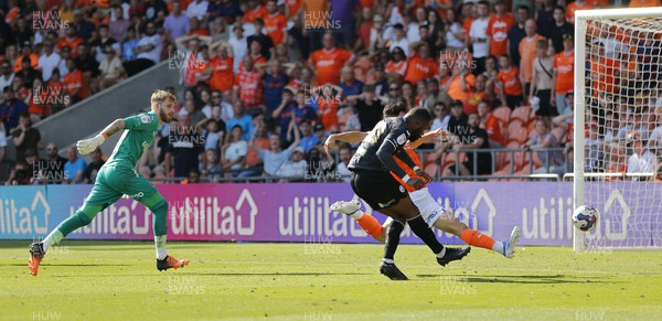 130822 - Blackpool v Swansea City - Sky Bet Championship - Olivier Ntcham of Swansea leaves Goalkeeper Daniel Grimshaw of Blackpool and Rhys Williams of Blackpool behind as he scores 1st goal of the match