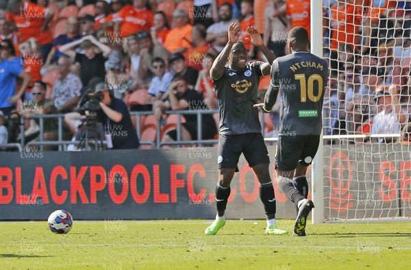 130822 - Blackpool v Swansea City - Sky Bet Championship - Olivier Ntcham of Swansea celebrates scoring the 1st goal of the match with assister Michael Obafemi of Swansea