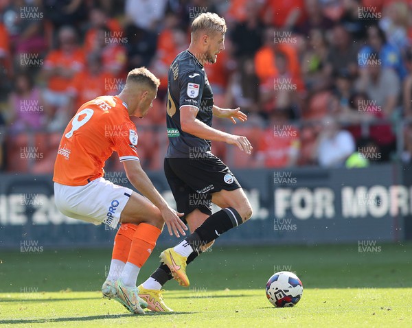 130822 - Blackpool v Swansea City - Sky Bet Championship - Harry Darling of Swansea is stalked by Jerry Yates of Blackpool