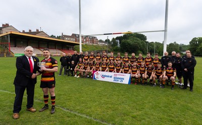 290525 - Blackwood RFC League Presentation - Blackwood RFC captain Josh Law is presented with the trophy by WRU representative Bryn Parker after winning the Admiral League Mens Division 2 East title