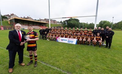 290525 - Blackwood RFC League Presentation - Blackwood RFC captain Josh Law is presented with the trophy by WRU representative Bryn Parker after winning the Admiral League Mens Division 2 East title