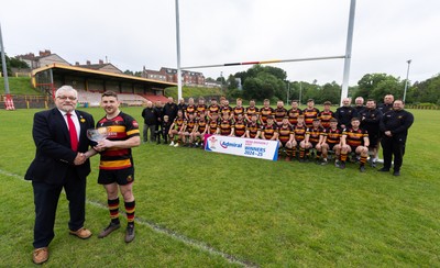 290525 - Blackwood RFC League Presentation - Blackwood RFC captain Josh Law is presented with the trophy by WRU representative Bryn Parker after winning the Admiral League Mens Division 2 East title
