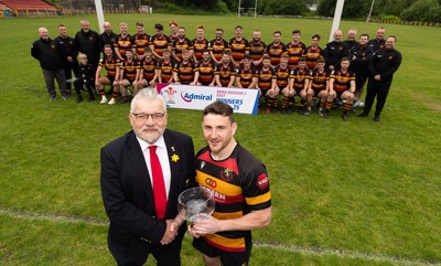 290525 - Blackwood RFC League Presentation - Blackwood RFC captain Josh Law is presented with the trophy by WRU representative Bryn Parker after winning the Admiral League Mens Division 2 East title
