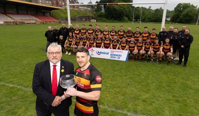 290525 - Blackwood RFC League Presentation - Blackwood RFC captain Josh Law is presented with the trophy by WRU representative Bryn Parker after winning the Admiral League Mens Division 2 East title