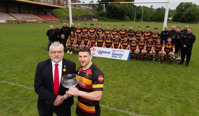 290525 - Blackwood RFC League Presentation - Blackwood RFC captain Josh Law is presented with the trophy by WRU representative Bryn Parker after winning the Admiral League Mens Division 2 East title