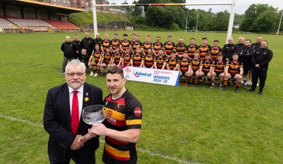 290525 - Blackwood RFC League Presentation - Blackwood RFC captain Josh Law is presented with the trophy by WRU representative Bryn Parker after winning the Admiral League Mens Division 2 East title