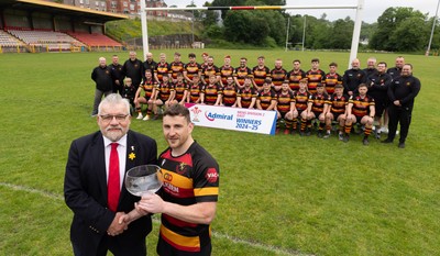290525 - Blackwood RFC League Presentation - Blackwood RFC captain Josh Law is presented with the trophy by WRU representative Bryn Parker after winning the Admiral League Mens Division 2 East title