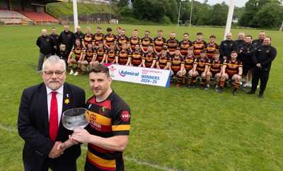 290525 - Blackwood RFC League Presentation - Blackwood RFC captain Josh Law is presented with the trophy by WRU representative Bryn Parker after winning the Admiral League Mens Division 2 East title