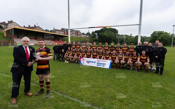 290525 - Blackwood RFC League Presentation - Blackwood RFC captain Josh Law is presented with the trophy by WRU representative Bryn Parker after winning the Admiral League Mens Division 2 East title