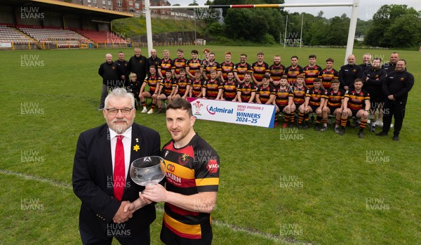 290525 - Blackwood RFC League Presentation - Blackwood RFC captain Josh Law is presented with the trophy by WRU representative Bryn Parker after winning the Admiral League Mens Division 2 East title