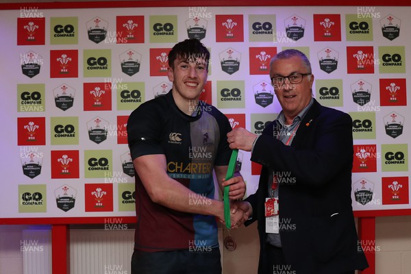 060424 - Blaina RFC v Cardiff Quins - Admiral Division 3 Cup Final - Man Of the Match Tomi Booth of Cardiff Quins receives his medal from Geraint John of the WRU
