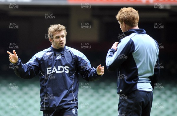 290313 - Blues Training - Captains Run - Leigh Halfpenny chats with Rhys Patchell at the Blues captains run