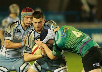 290212 Cardiff Blues South U16 v Ospreys U16 - Regional Age Grade Competition Final -Blues' Rory Bartle is tackled by Ospreys' Adam Beard