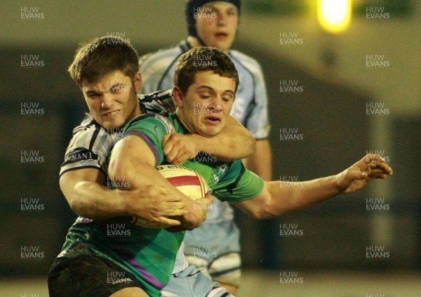 290212 Cardiff Blues South U16 v Ospreys U16 - Regional Age Grade Competition Final -Ospreys' Jo Thomas is tackled by Blues' Harry Roberts