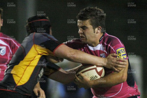 30.09.09 Cardiff Blues South Under 16's v Dragons U16's -  Blues' Tom Perry charges at Niall Martin. 