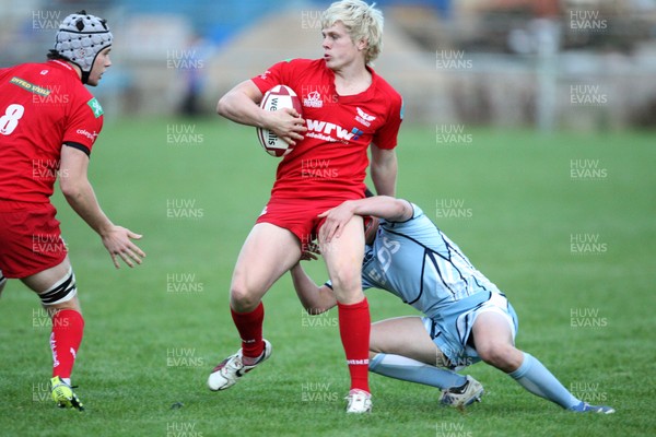 14.09.11 - Cardiff Blues U18's v Scarlets U18's - Age Grade Regional Championship -  Scarlets' Daniel Thomas is held 