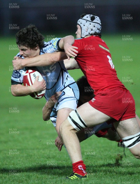 14.09.11 - Cardiff Blues U18's v Scarlets U18's - Age Grade Regional Championship -  Blues' Sam Edwards is tackled by Scarlets' Sion Bennett and Scarlets' Thomas Ball   