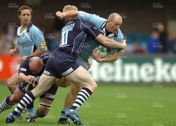 11.11.07 - Cardiff Blues v Bristol - Heineken Cup - Cardiff's Gareth Thomas is tackled by Bristol's Lee Robinson 