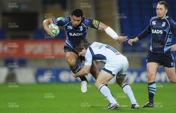 14.01.11 - Cardiff Blues v Castres Olympique - Heineken Cup - Casey Laulala of Cardiff Blues is tackled by Marc Andreu of Castres Olympique. 