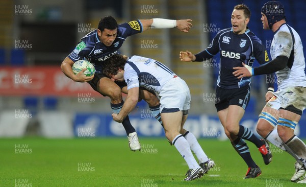 14.01.11 - Cardiff Blues v Castres Olympique - Heineken Cup - Casey Laulala of Cardiff Blues is tackled by Marc Andreu of Castres Olympique. 