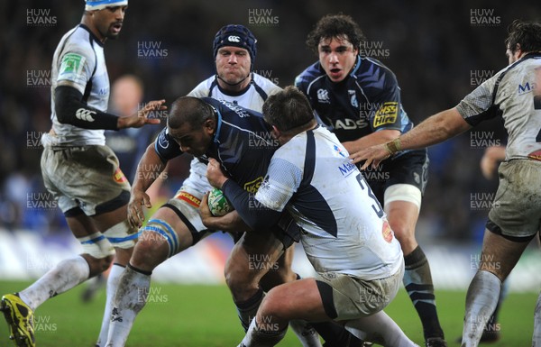 14.01.11 - Cardiff Blues v Castres Olympique - Heineken Cup - Tafa'ao Filise of Cardiff Blues is tackled by Daniel Saayman of Castres Olympique. 