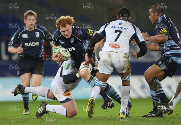 14.01.11.... Cardiff Blues v Castres, Heieken Cup -  Paul Tito of Cardiff Blues takes on Daniel Saayman and Steve Malonga of Castres Olympique 