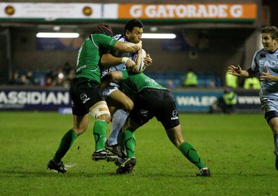 100212 Cardiff Blues v Connacht - RaboDirect PRO 12 -Blues' Casey Laulala is tackled by Connacht's Ray Ofisa(L) and Ronan Loughney 