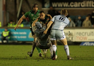 100212 Cardiff Blues v Connacht - RaboDirect PRO 12 -Connacht's Fetu'u Vanikolo is tackled by Blues' Michael Paterson(4) and Ryan Tyrrell