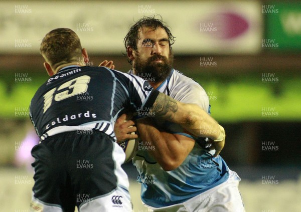 061012 Cardiff Blues v Glasgow Warriors - RaboDirect PRO 12 -Glasgow's Josh Strauss is tackled by Blues' Gavin Evans