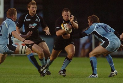 220906 - Cardiff Blues v Glasgow Warriors -  Magners League - Glasgow's Scott Barrow is tackled by Nicky Robinson(rt) and Rhys Thomas 