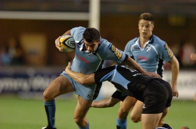 220906  Cardiff Blues v Glasgow  Blues Tom Riley is tackled by Dan Parks  