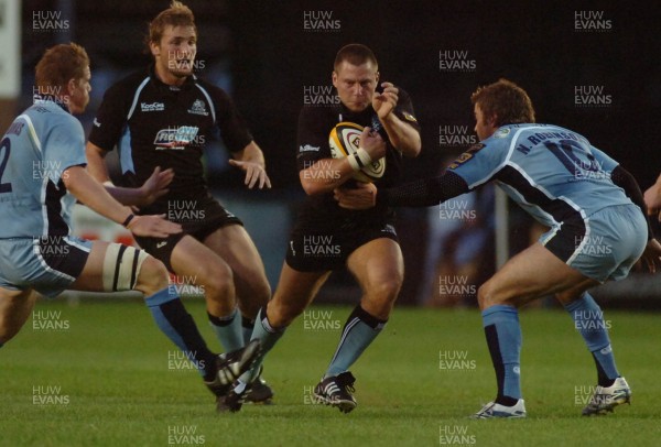 220906 - Cardiff Blues v Glasgow Warriors -  Magners League - Glasgow's Scott Barrow is tackled by Nicky Robinson(rt) and Rhys Thomas 