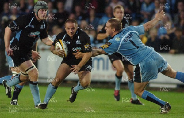 220906 - Cardiff Blues v Glasgow Warriors -  Magners League - Glasgow's Graeme Beveridge is tackled by Gethin Jenkins 