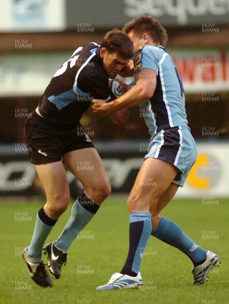 220906 - Cardiff Blues v Glasgow Warriors -  Magners League - Glasgow's Francisco Leonelli is tackled by Chris Czekaj 