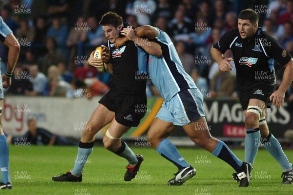 220906 - Cardiff Blues v Glasgow Warriors -  Magners League - Glasgow's John Beattie is tackled by Toufaao Filise 