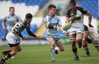 05.02.12 - Cardiff Blues v Harlequins, LV= Cup -.Blues Ceri Sweeney offloads as Harlequins Karl Dickson closes in.